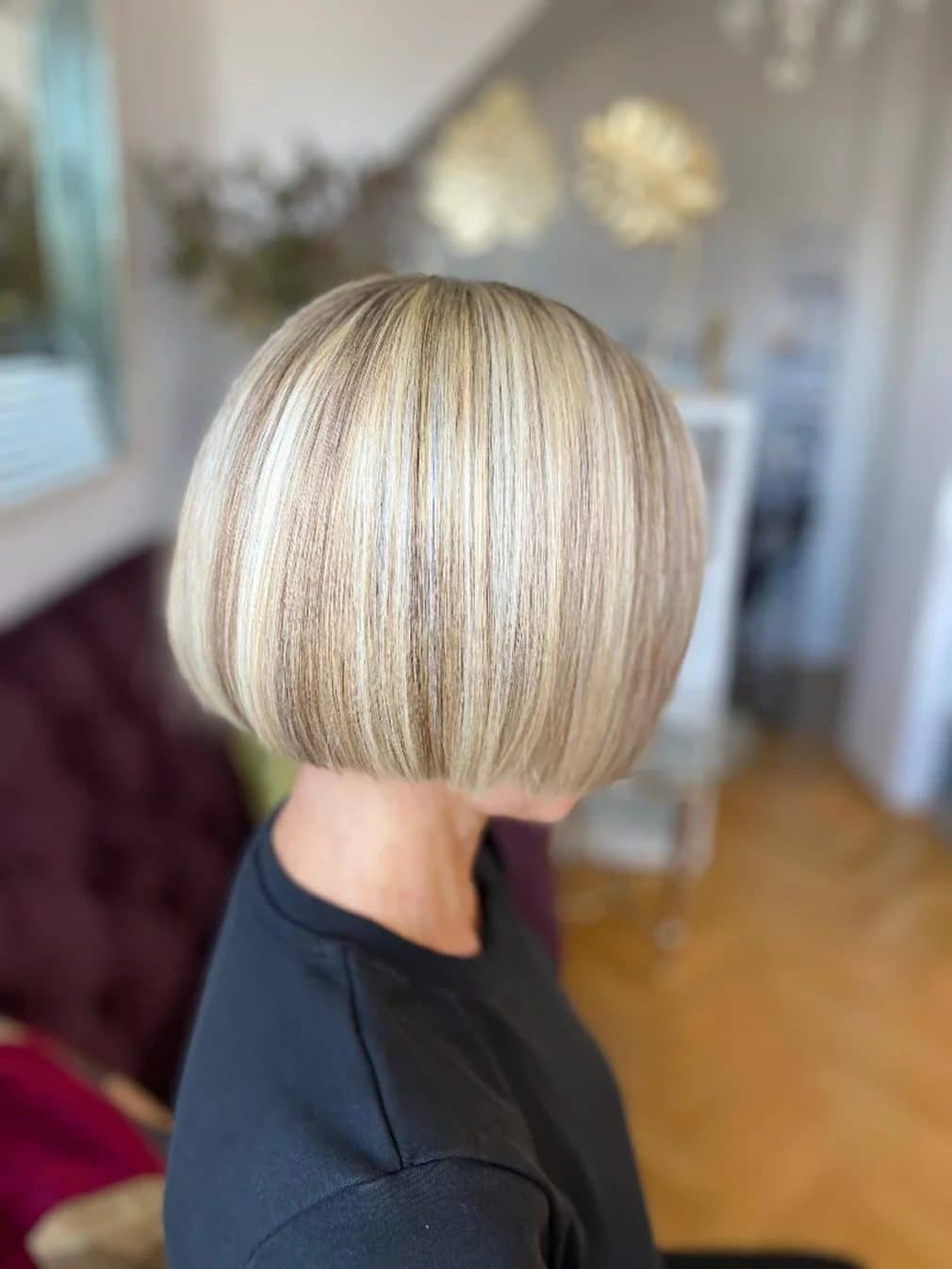 Short blonde bob with highlights, from behind
